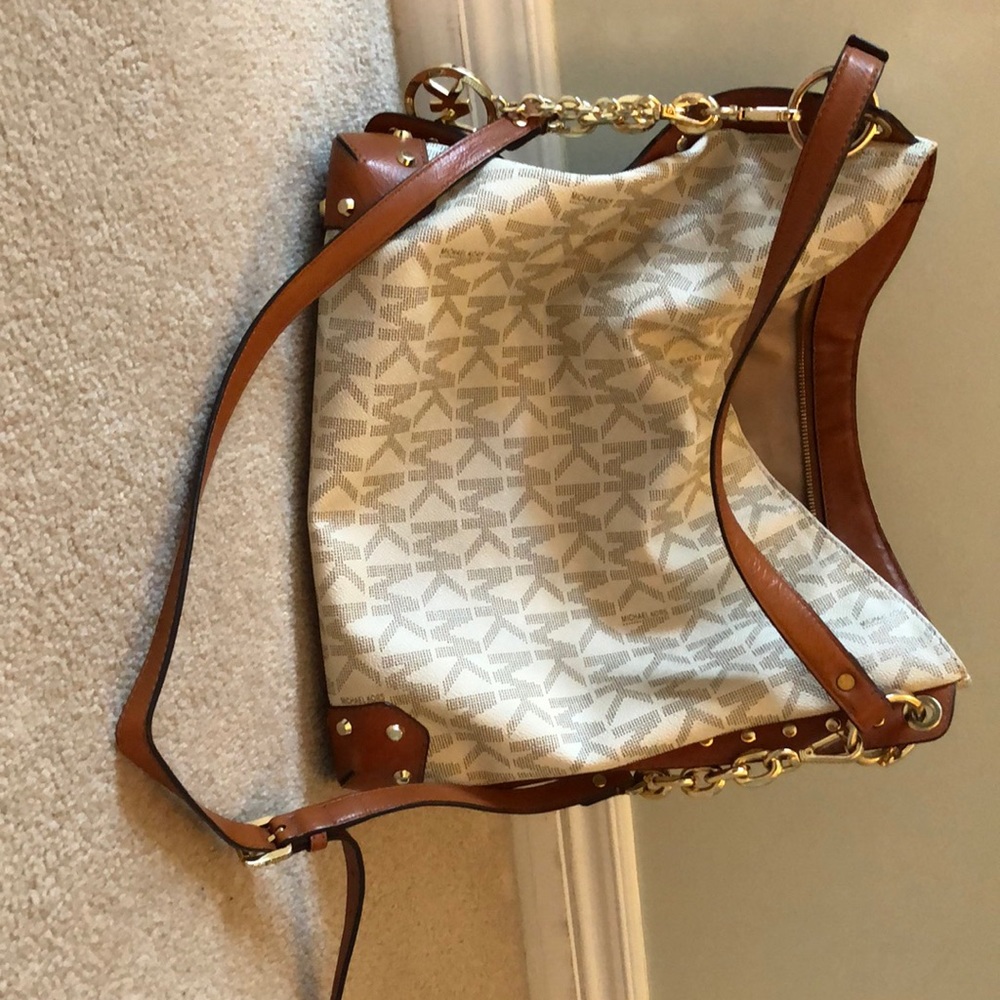 Michael Kors purse with gold studs and emblem